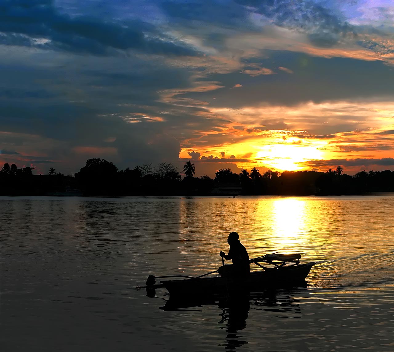 Lucky Canoe in the brassy glow of the rising sun Lucky Canoe in the brassy glow of the rising sun