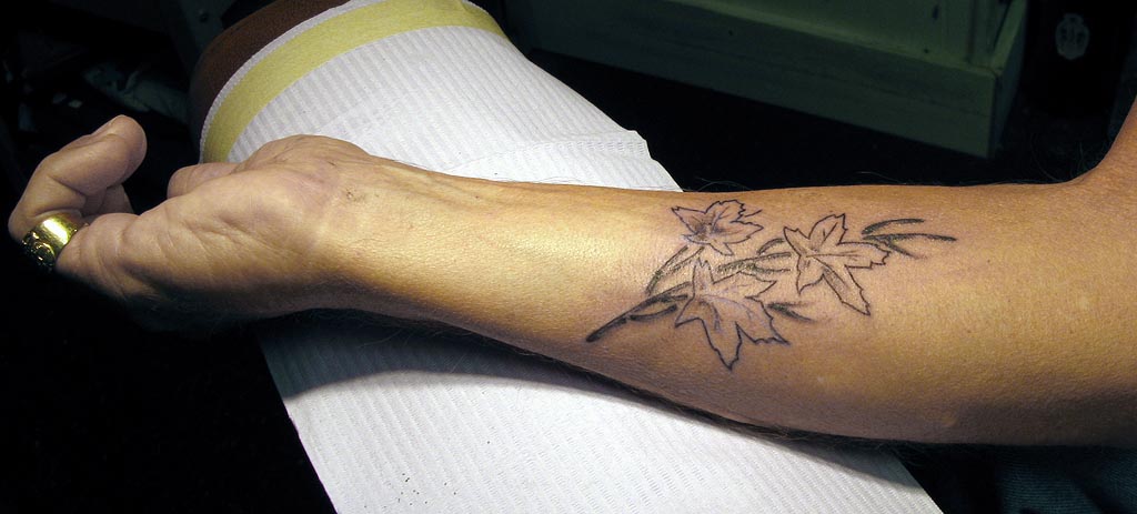 LOOK AWAY NOW, IF YOU'RE SQUEAMISH ABOUT TATTOOS.