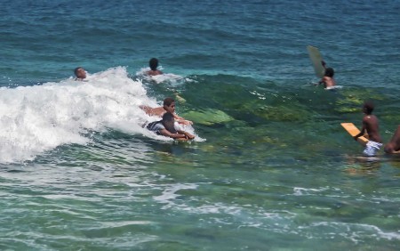 Kids surfing along Coronation Drive