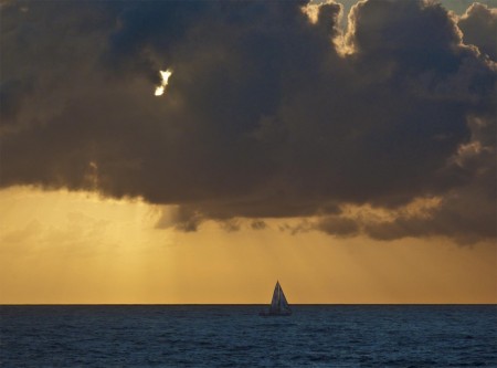 Sailboat at sunrise on Astrolabe Bay Sailboat at sunrise on Astrolabe Bay