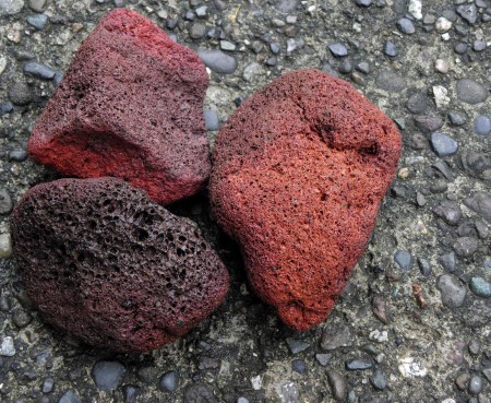 Three bits of volcanic pumice belched from the Manam Island volcano