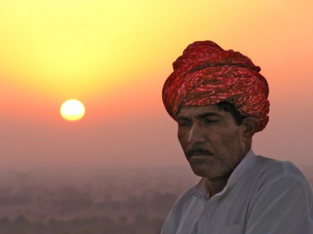 Indian Man at Sunrise by Val Jerram