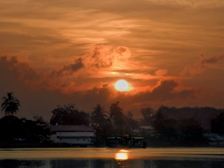 Madang sunrise with copra boat heading to Kar Kar Island
