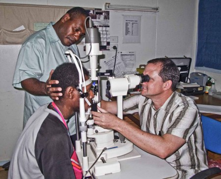 Dr. Rob and Adolf examining a patient