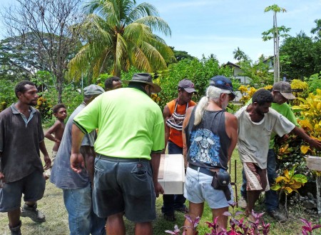 Carrying the marker to the grave site